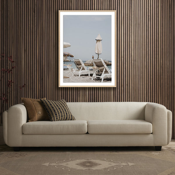 PEOPLE WATCHING FROM A LOUNGER