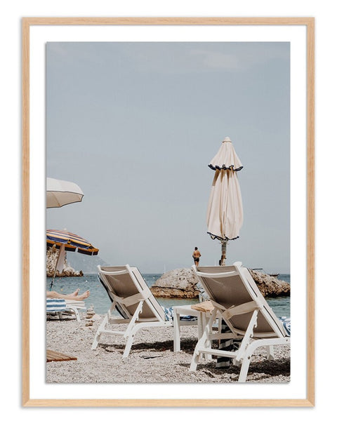 PEOPLE WATCHING FROM A LOUNGER